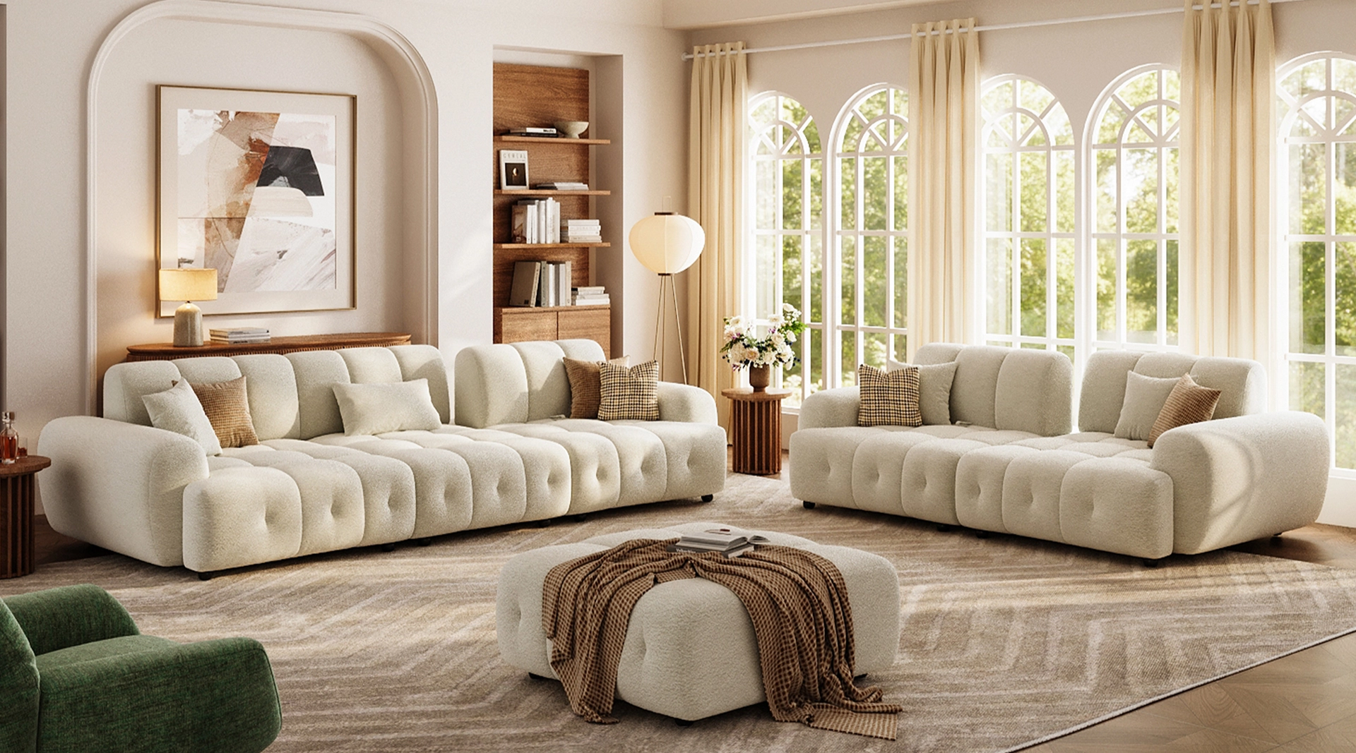 a wide oversized sofa in a large living room layout